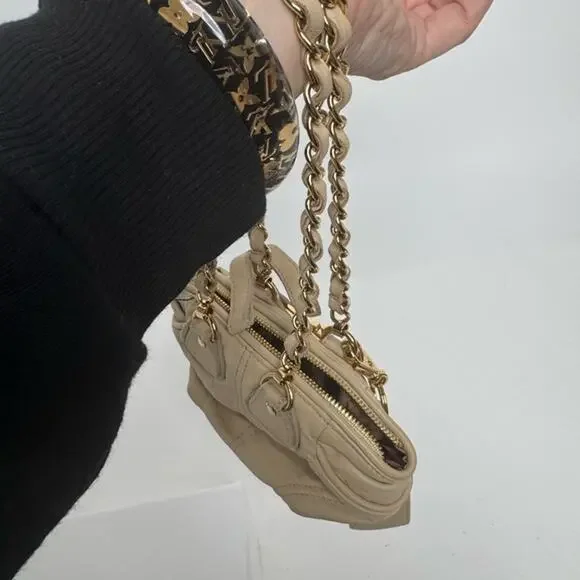 Dolce and Gabbana miniature leather bag with kiss lock, plaque and gold hardware